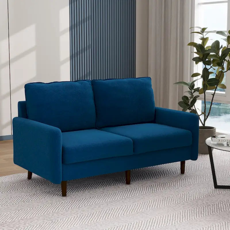 Divano moderno con gambe in legno e velluto